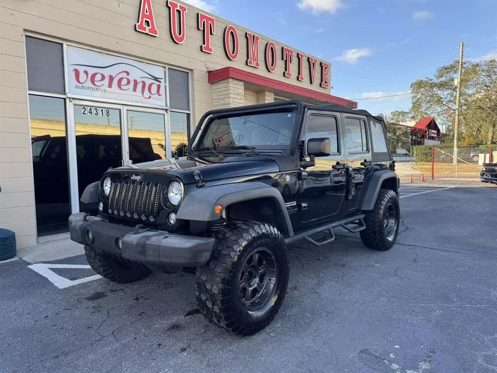 Used 2017 Jeep Wrangler Unlimited Sport with VIN 1C4BJWDGXHL658046 for sale in Clearwater, FL