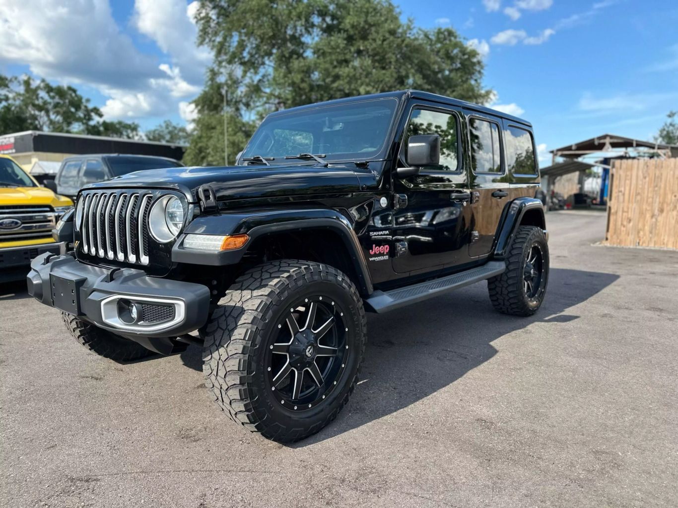 2018 JEEP WRANGLER UNLIMITED SUV 4-CYL, TURBO, 2.0 LITER ALL NEW SAHARA SPORT UTILITY 4D - Tampa Motor Cars