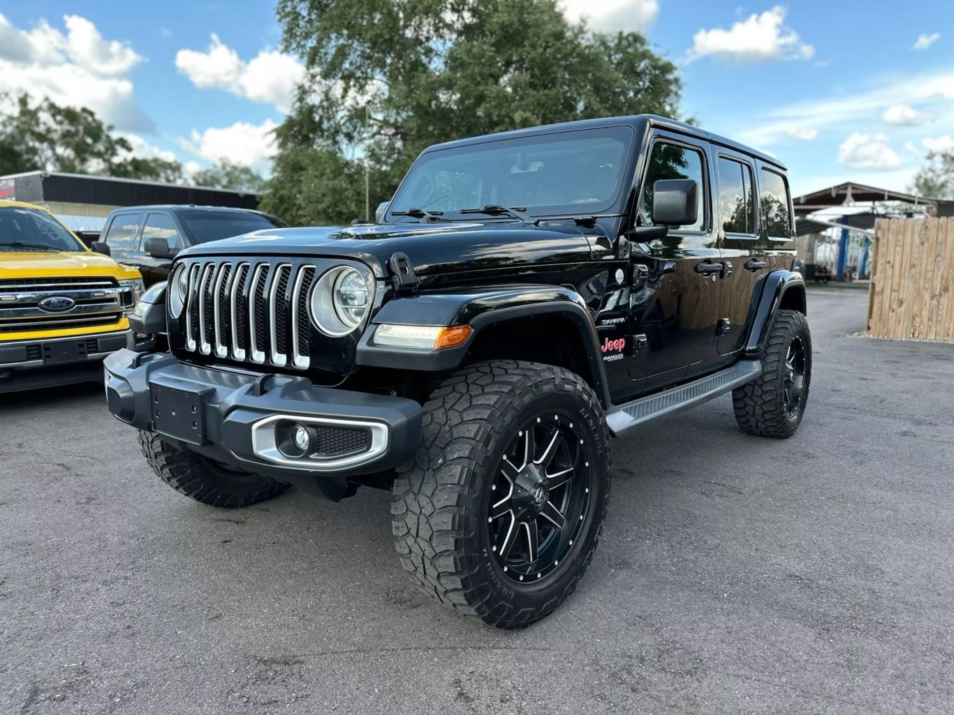 2018 JEEP WRANGLER UNLIMITED SUV 4-CYL, TURBO, 2.0 LITER ALL NEW SAHARA SPORT UTILITY 4D - Tampa Motor Cars