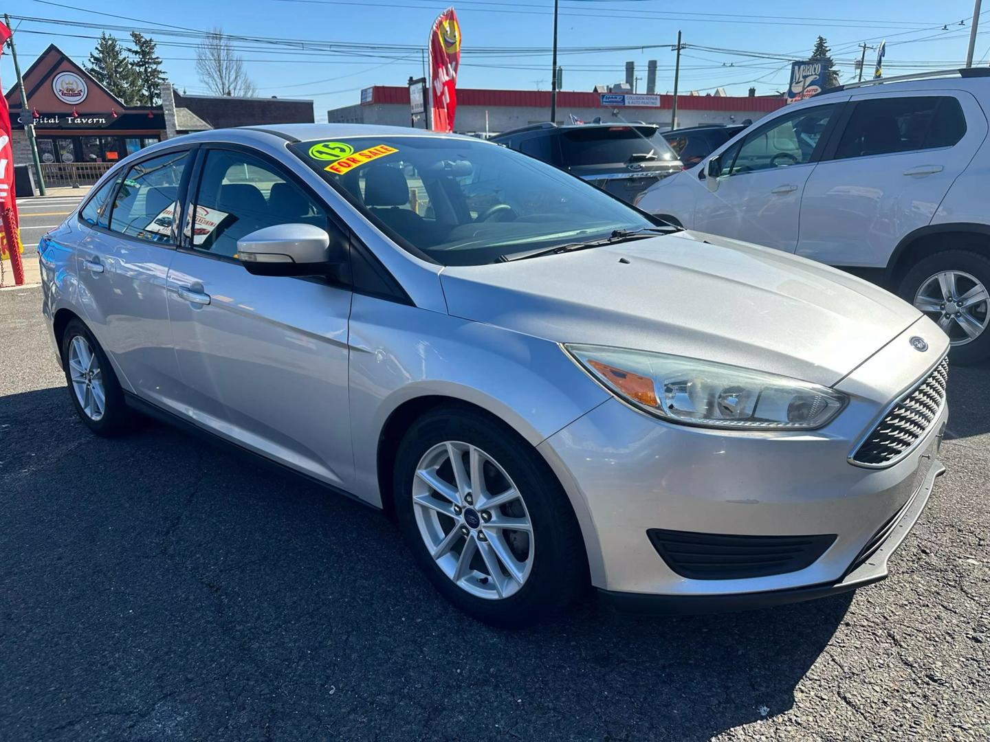 2015 Ford Focus parked outdoors, showcasing its sleek design and compact build.