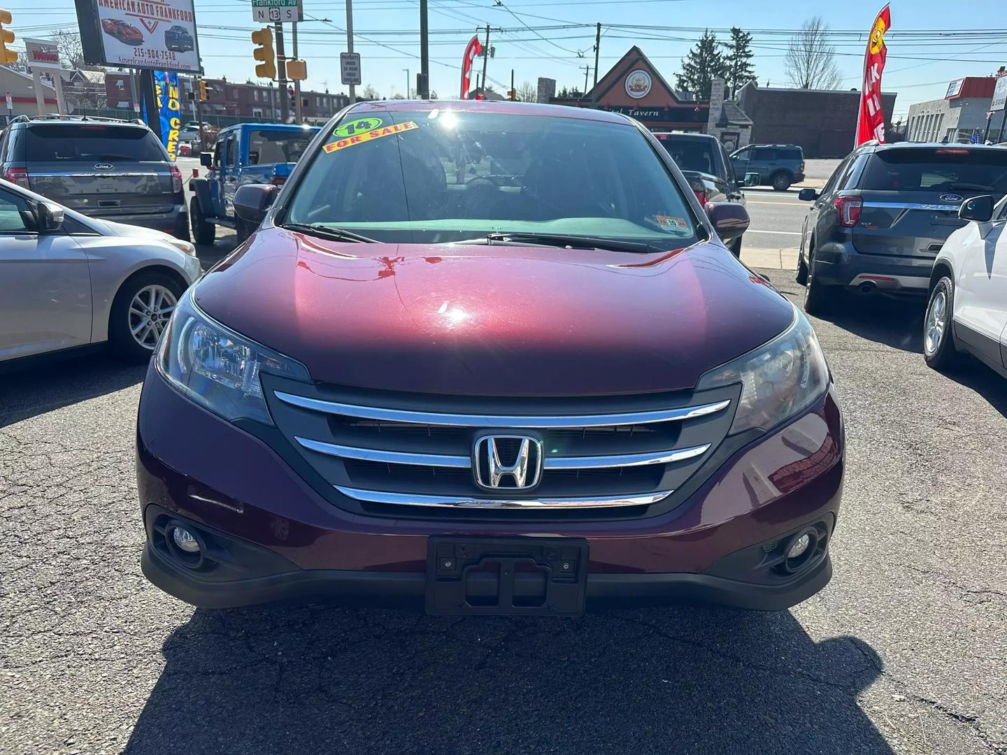 2014 Honda CR-V showcasing its sleek design and robust build, highlighting the SUV's versatility and modern features.