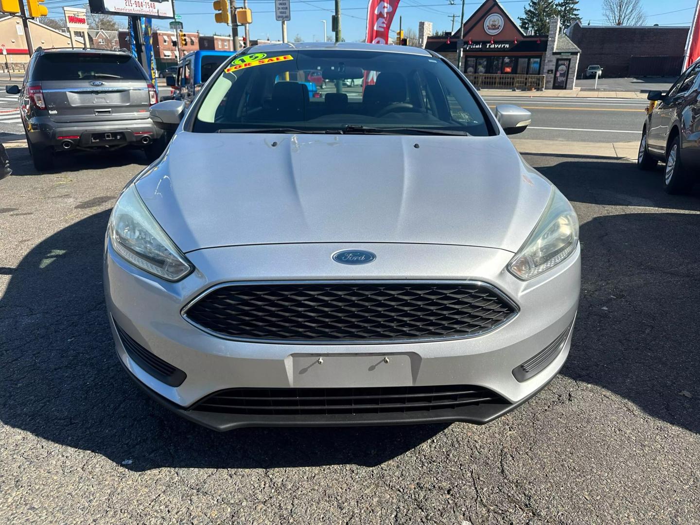 2015 Ford Focus parked outdoors, showcasing its sleek design and compact build.