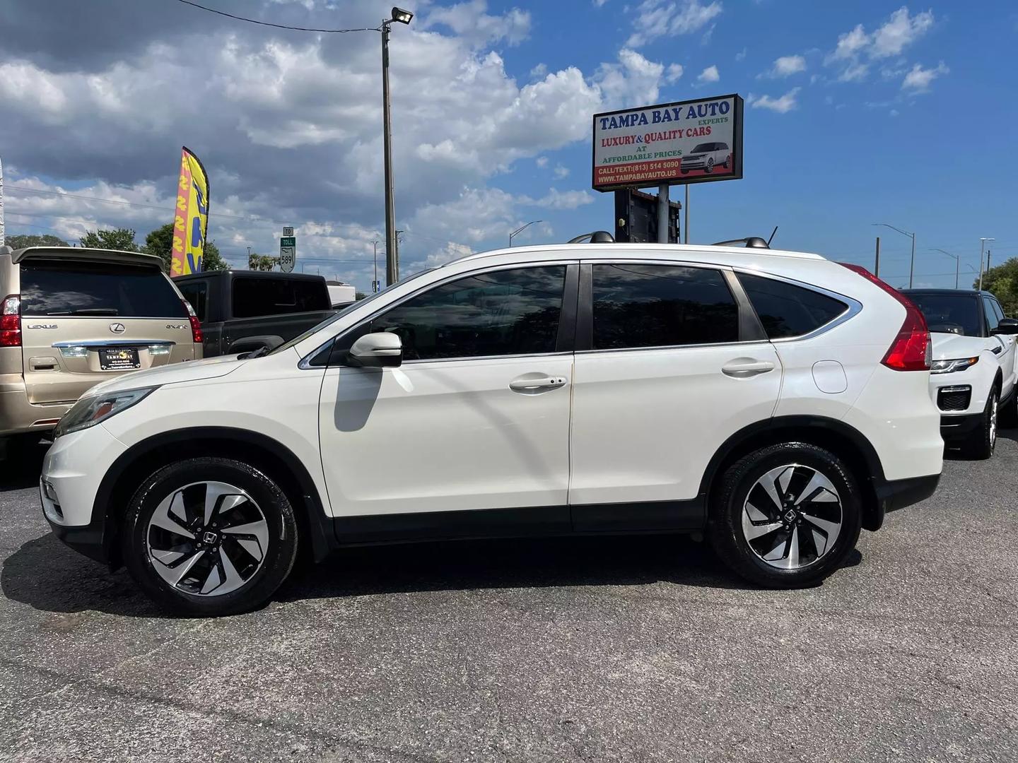 Used 2016 Honda CR-V Touring with VIN 5J6RM4H99GL031370 for sale in Tampa, FL