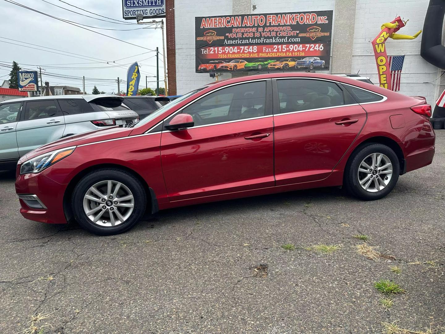 A sleek 2015 Hyundai Sonata parked outdoors, showcasing its modern design and aerodynamic profile.