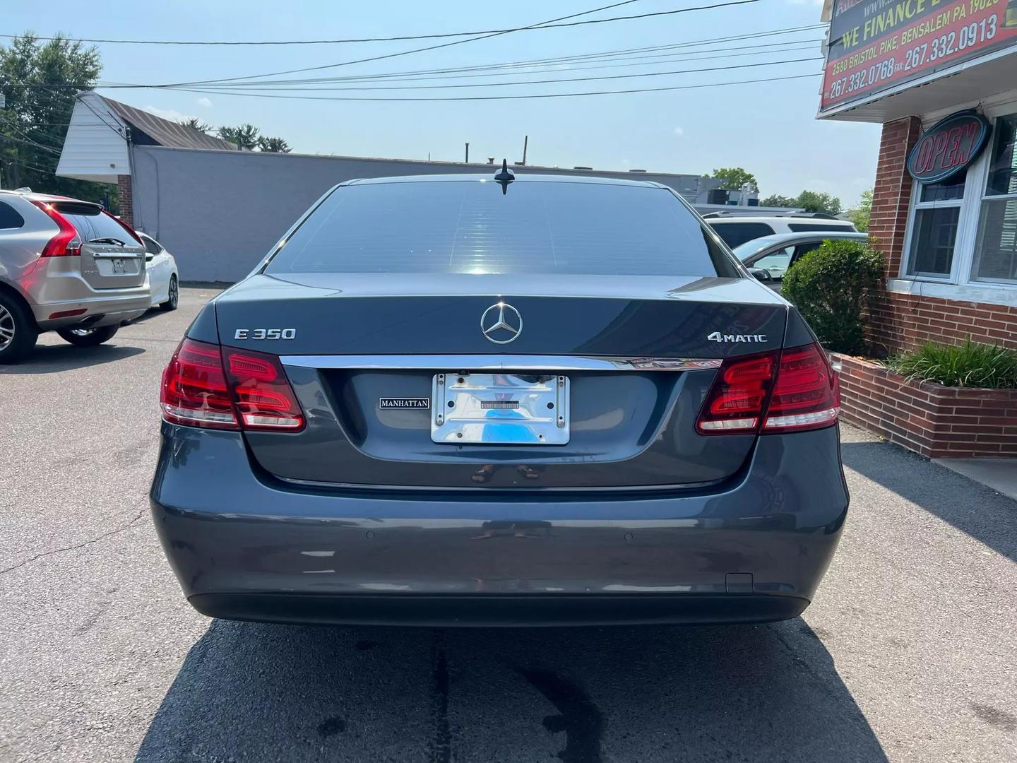 A 2014 Mercedes-Benz E-Class luxury sedan, featuring a sleek design with elegant curves, iconic front grille, and stylish headlights.