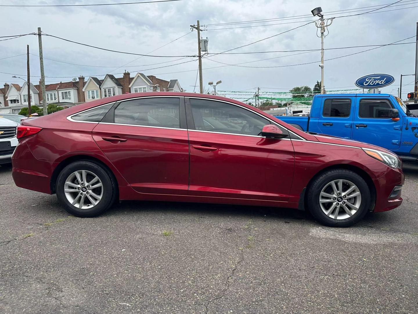 A sleek 2015 Hyundai Sonata parked outdoors, showcasing its modern design and aerodynamic profile.