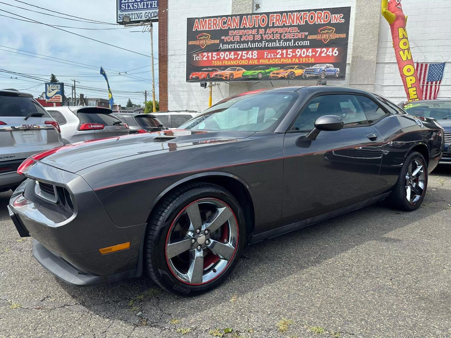 2014 Dodge Challenger with a bold design and sleek exterior, showcasing its powerful and dynamic presence.