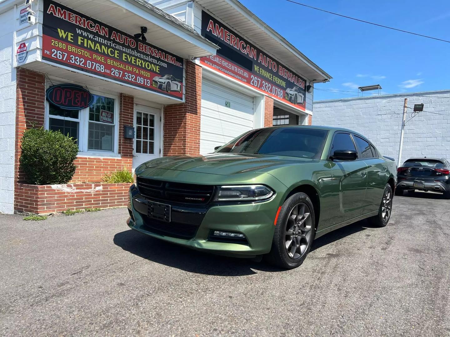 Front view of the 2018 Dodge Charger showcasing its bold, muscular design, distinctive grille, and sleek headlights.