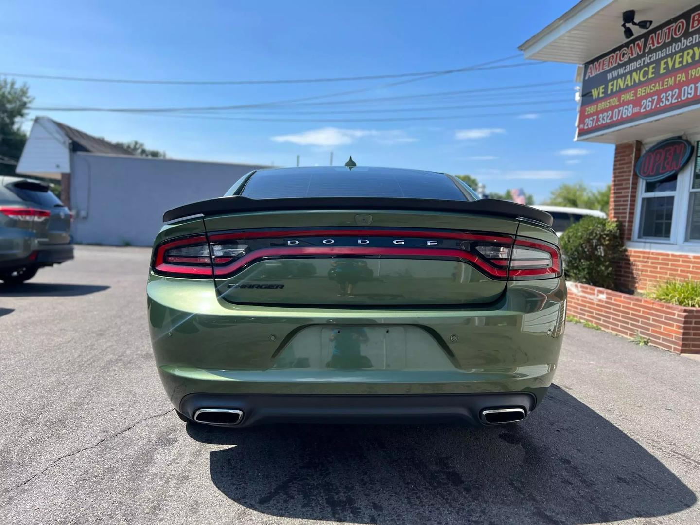 Front view of the 2018 Dodge Charger showcasing its bold, muscular design, distinctive grille, and sleek headlights.