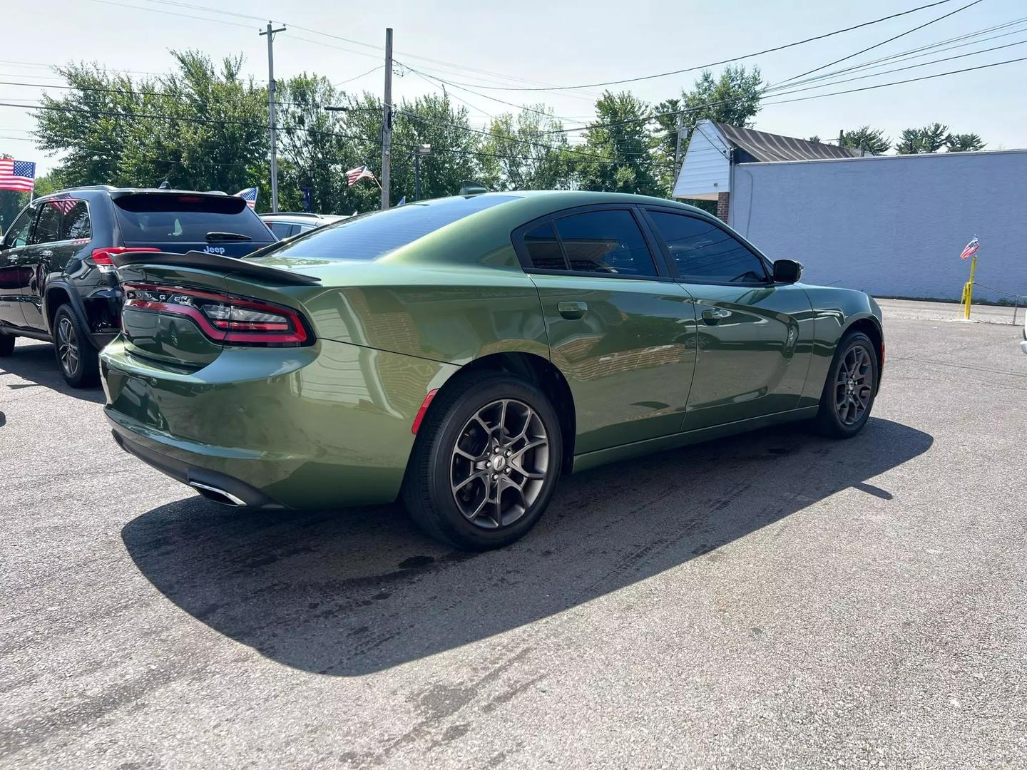 Front view of the 2018 Dodge Charger showcasing its bold, muscular design, distinctive grille, and sleek headlights.