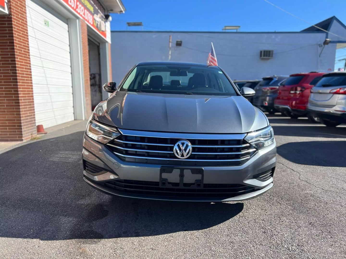 2019 Volkswagen Jetta with a sleek, modern design, showcasing its stylish exterior, advanced headlights, and smooth body lines.