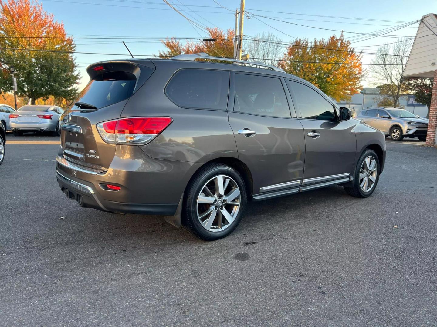 2016 Nissan Pathfinder, highlighting its sleek design, prominent grille, and stylish headlights.