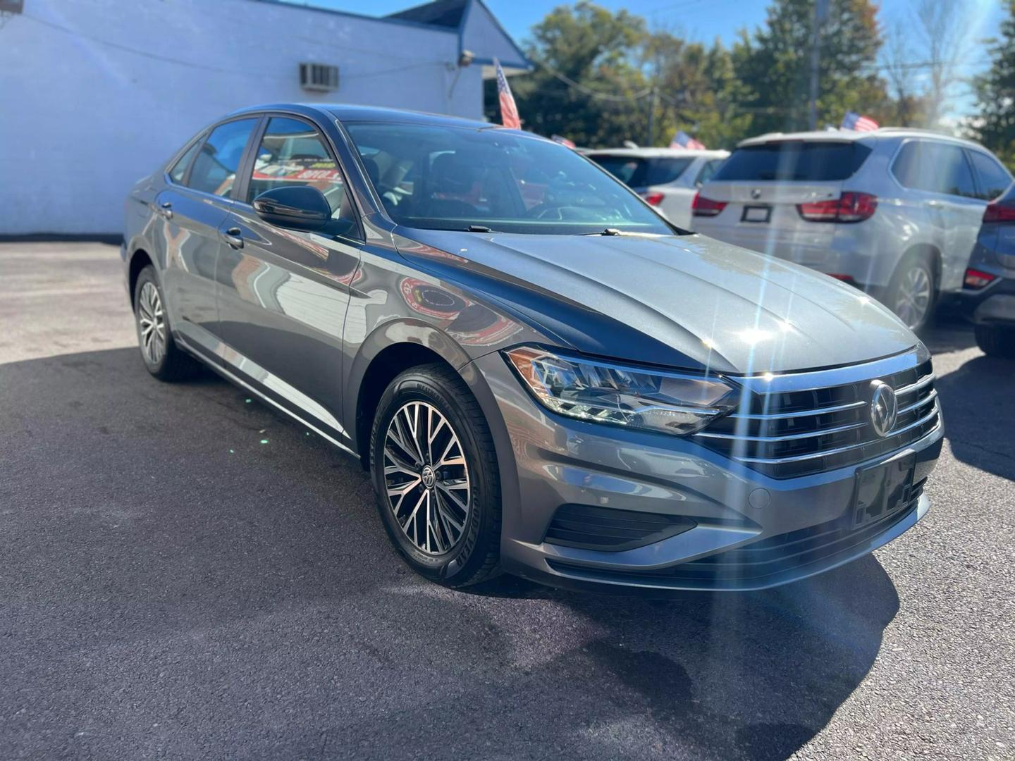 2019 Volkswagen Jetta with a sleek, modern design, showcasing its stylish exterior, advanced headlights, and smooth body lines.