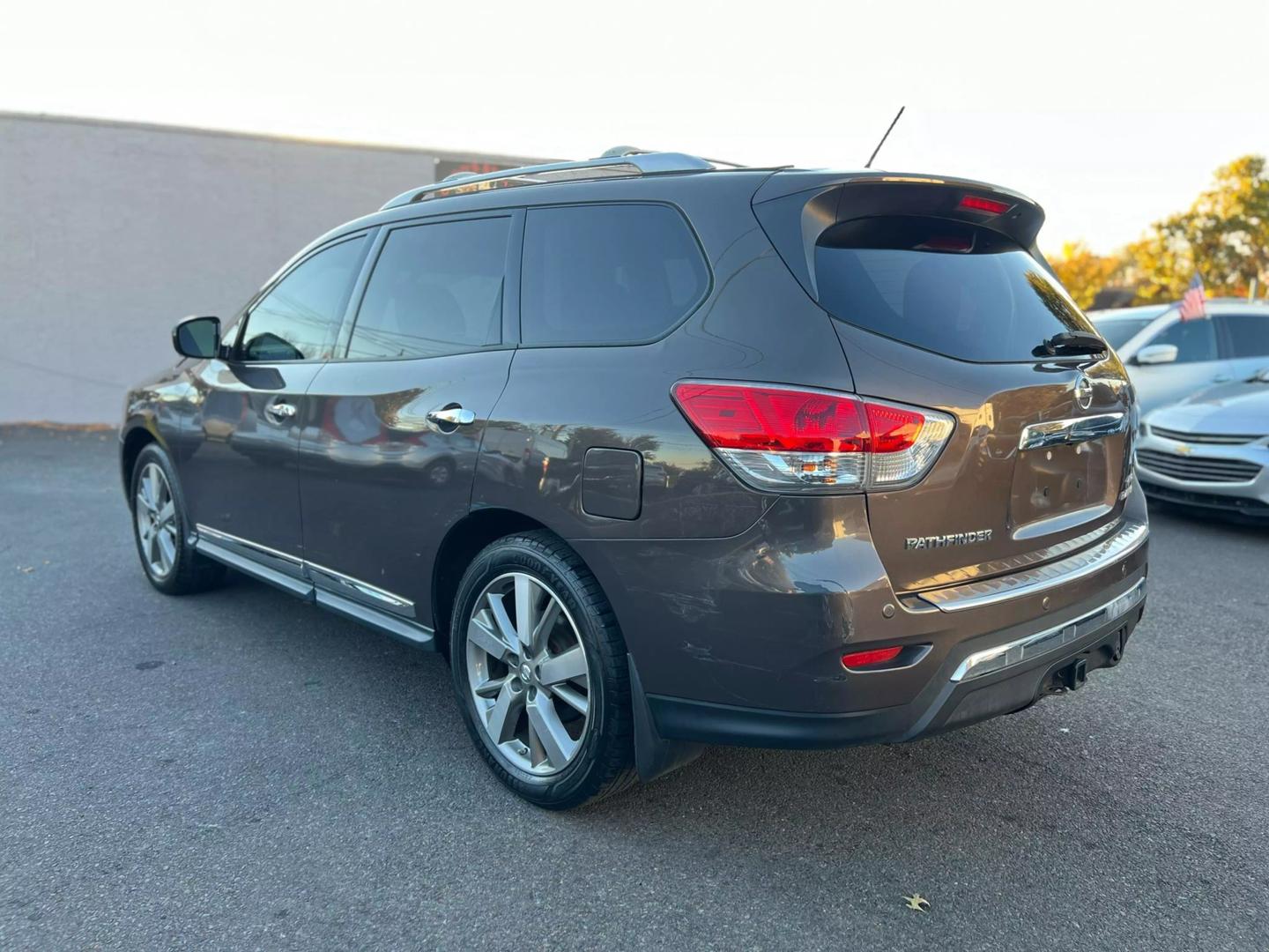 2016 Nissan Pathfinder, highlighting its sleek design, prominent grille, and stylish headlights.