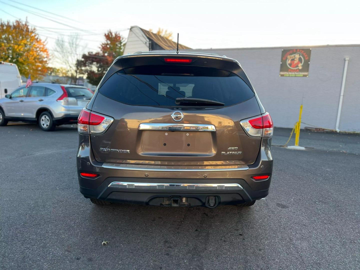 2016 Nissan Pathfinder, highlighting its sleek design, prominent grille, and stylish headlights.