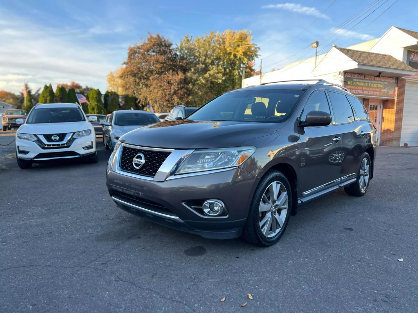 2016 Nissan Pathfinder, highlighting its sleek design, prominent grille, and stylish headlights.