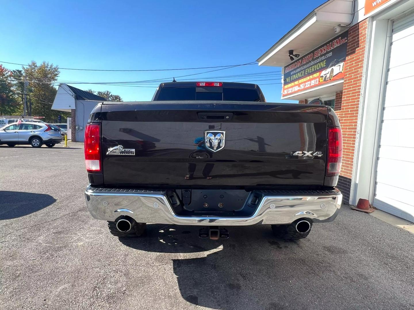 2017 RAM 1500 Crew Cab SLT Pickup in black with 4WD and V8 HEMI engine, featuring a spacious gray interior