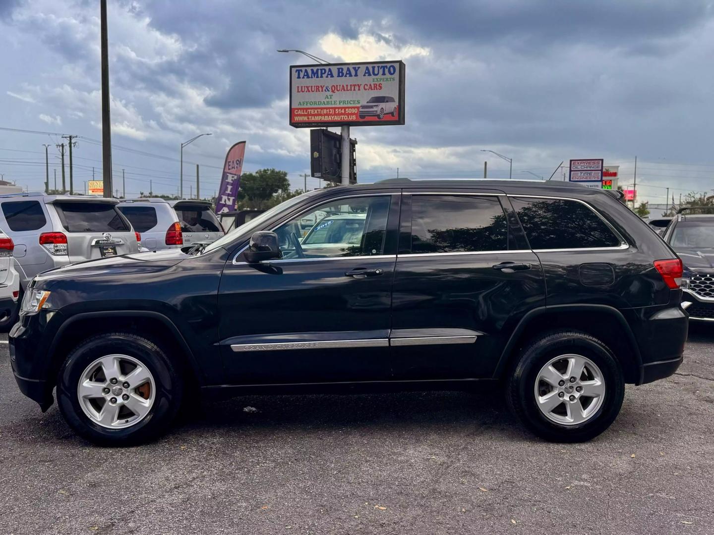 Used 2012 Jeep Grand Cherokee Laredo with VIN 1C4RJFAG1CC176240 for sale in Tampa, FL