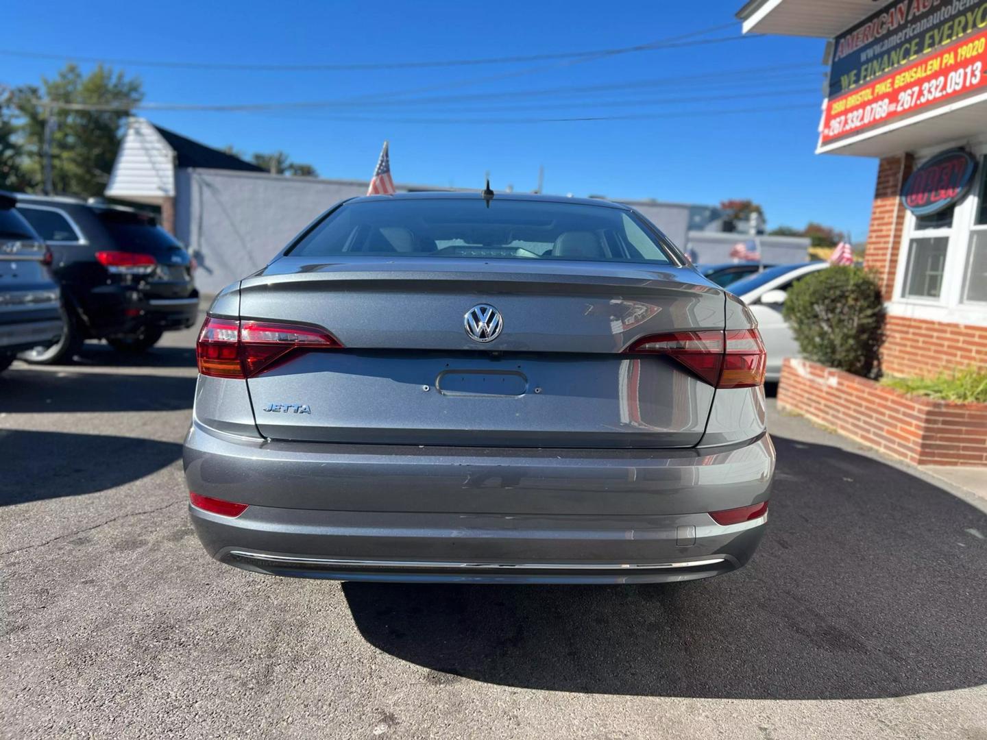 2019 Volkswagen Jetta with a sleek, modern design, showcasing its stylish exterior, advanced headlights, and smooth body lines.