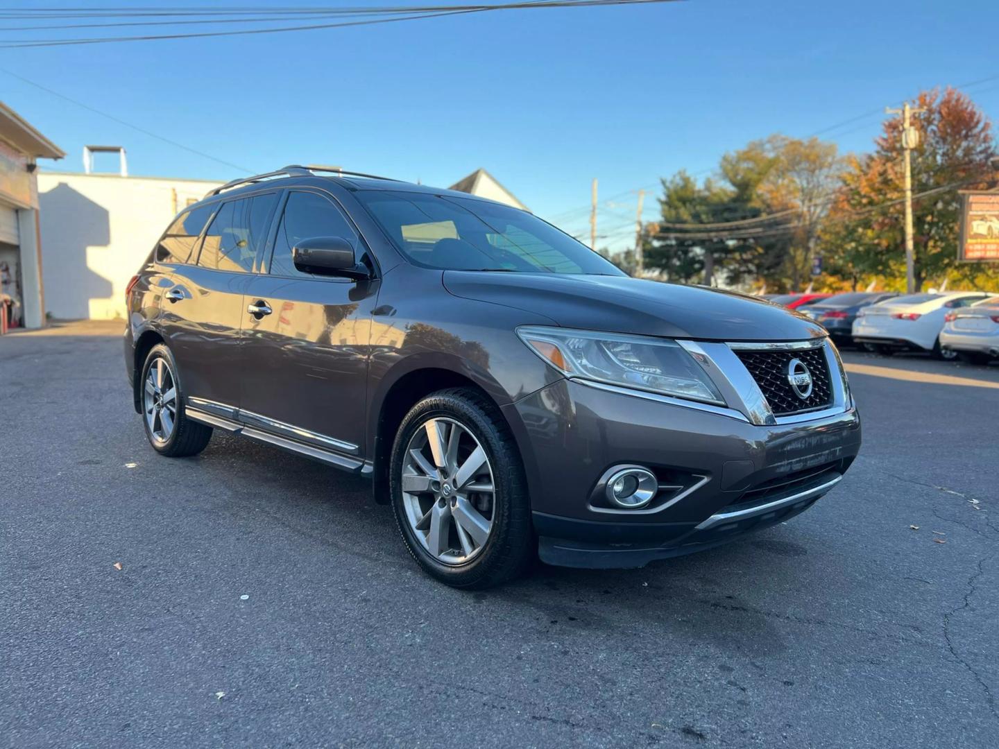 2016 Nissan Pathfinder, highlighting its sleek design, prominent grille, and stylish headlights.