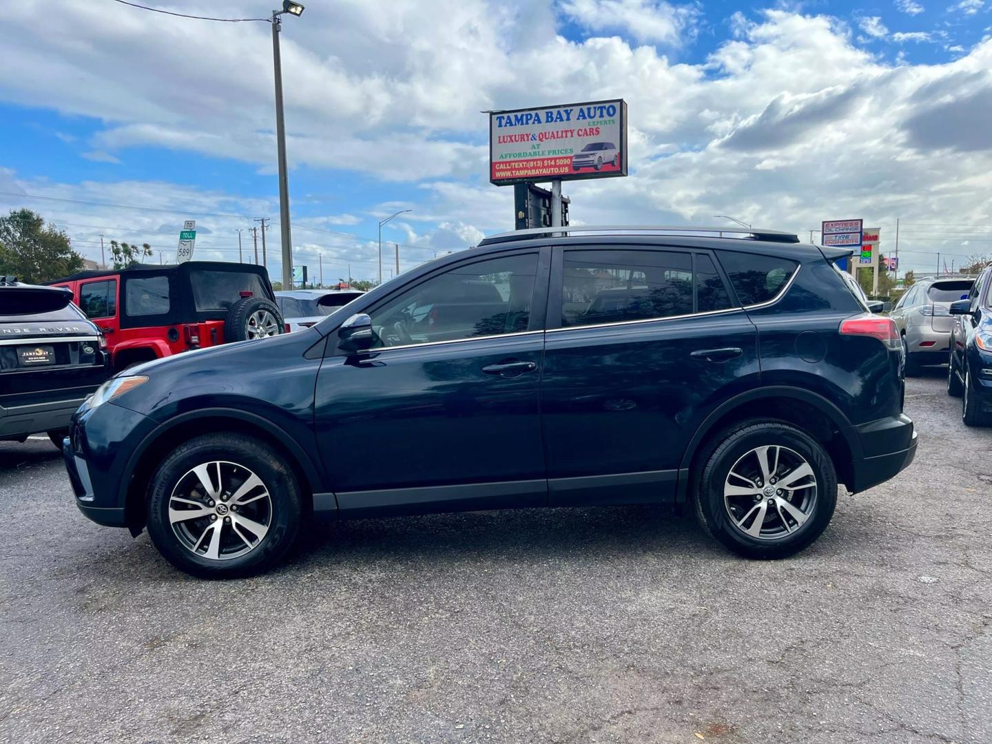 Used 2018 Toyota RAV4 XLE with VIN JTMWFREV7JD123547 for sale in Tampa, FL