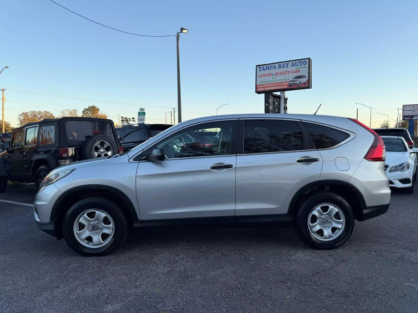 Used 2015 Honda CR-V LX with VIN 3CZRM3H36FG711759 for sale in Tampa, FL