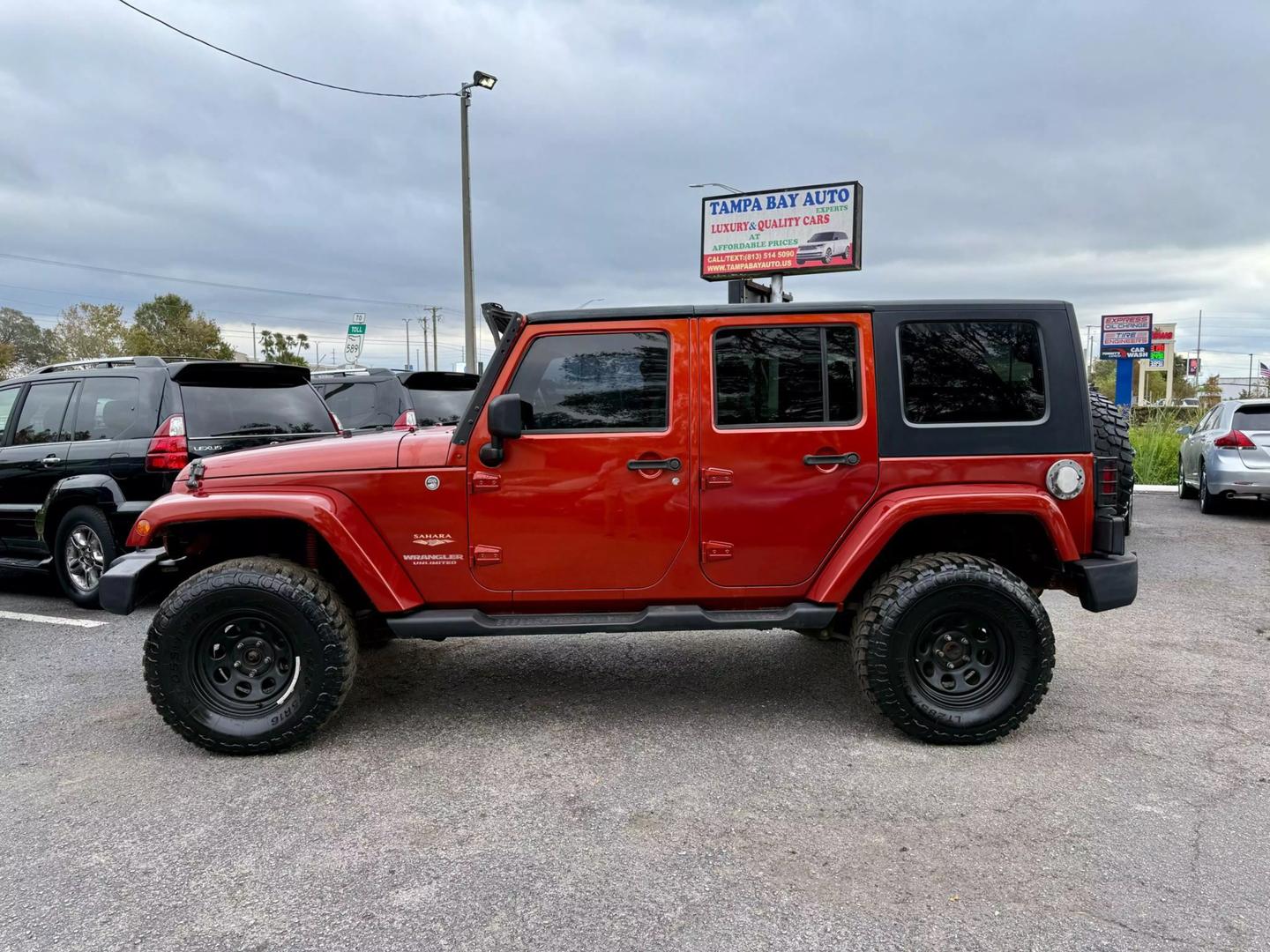 Used 2009 Jeep Wrangler Unlimited Sahara with VIN 1J4GA59129L756830 for sale in Tampa, FL