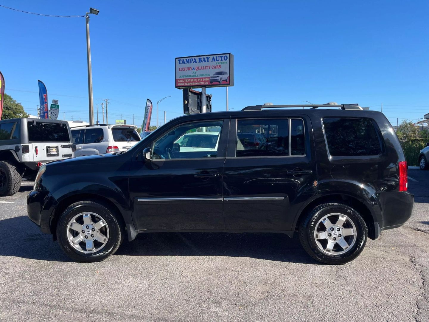 Used 2011 Honda Pilot Touring with VIN 5FNYF4H93BB033817 for sale in Tampa, FL