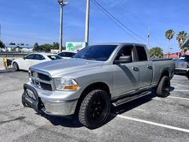 2012 RAM 1500 QUAD CAB PICKUP BRIGHT SILVER METALLIC CLEARCOAT AUTOMATIC - Tropical Auto Sales
