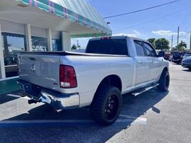 2012 RAM 1500 QUAD CAB PICKUP BRIGHT SILVER METALLIC CLEARCOAT AUTOMATIC - Tropical Auto Sales
