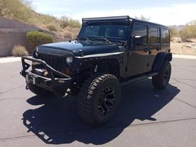 2012 JEEP WRANGLER SUV V6, 3.6 LITER UNLIMITED SPORT SUV 4D at The one Auto Sales in Phoenix, AZ