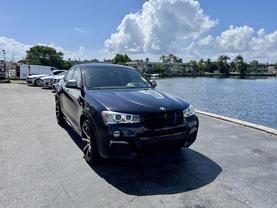 2017 BMW X4 SUV CARBON BLACK METALLIC AUTOMATIC - Tropical Auto Sales