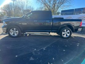 2016 RAM 1500 QUAD CAB PICKUP BLACK AUTOMATIC - Auto Spot