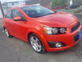2012 CHEVROLET SONIC SEDAN ORANGE AUTOMATIC - Auto Spot