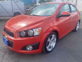 2012 CHEVROLET SONIC SEDAN ORANGE AUTOMATIC - Auto Spot
