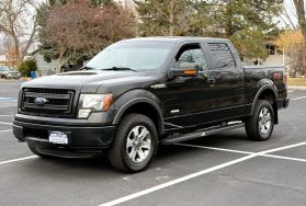 2014 FORD F150 SUPERCREW CAB PICKUP TUXEDO BLACK METALLIC AUTOMATIC - Capital City Auto