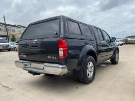 2010 NISSAN FRONTIER PICKUP V6 4.0L GASOLINE CREW CAB LE 4WD 4.0L V6 at Motors On Wheels - used car dealership in Houston, Texas.