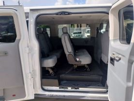 2015 FORD TRANSIT 150 WAGON PASSENGER V6, FLEX FUEL, 3.7 LITER XLT W/LOW ROOF W/60/40 SIDE DOOR VAN 3D at Motors On Wheels - used car dealership in Houston, Texas.