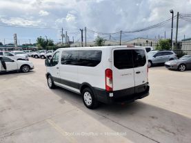 2015 FORD TRANSIT 150 WAGON PASSENGER V6, FLEX FUEL, 3.7 LITER XLT W/LOW ROOF W/60/40 SIDE DOOR VAN 3D at Motors On Wheels - used car dealership in Houston, Texas.