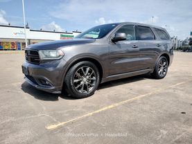 2014 DODGE DURANGO SUV V6, FLEX FUEL, 3.6 LITER SXT SPORT UTILITY 4D at Motors On Wheels - used car dealership in Houston, Texas.
