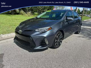 2018 TOYOTA COROLLA SEDAN GREY MANUAL - PALM BEACH MOTORS in Lake Worth, FL 26.6177971223543, -80.07099620226047