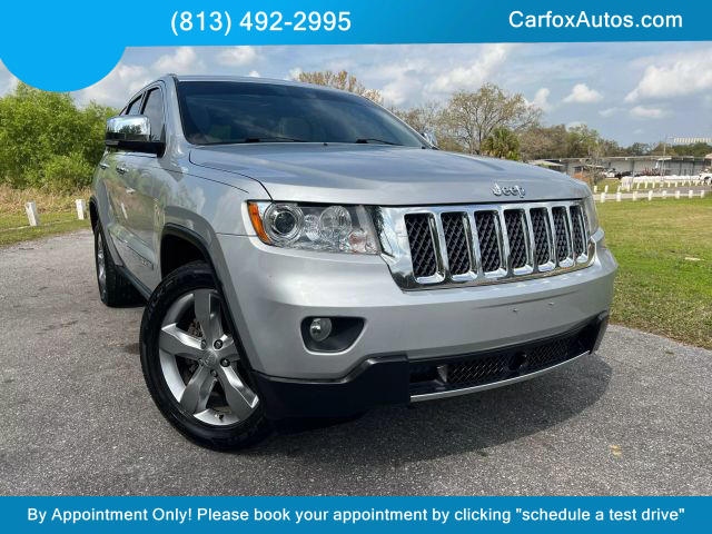2013 JEEP GRAND CHEROKEE SUV V6, FLEX FUEL, 3.6 LITER OVERLAND SPORT UTILITY 4D at Carfox Auto Sales in Tampa, FL. 28.071273613212345, -82.44776520995791